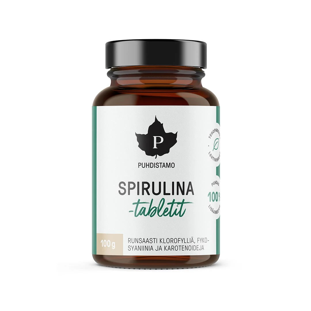 Puhdistamo Spirulinatabletit 100 g tummassa purkissa, jossa on valkoinen etiketti ja vihreitä yksityiskohtia., kuva 1/1