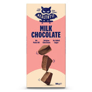 HealthyCo Chocolate 100 g -maitosuklaa beige-pinkissä pakkauksessa, jossa on kolme pinottua suklaapalaa.