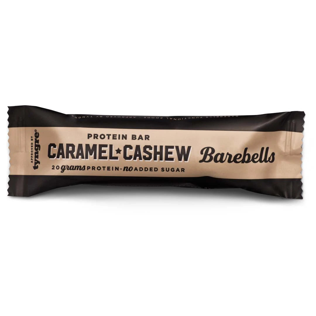 Barebells Soft protein bar 55 g tummanruskeassa ja beigessä pakkauksessa, makuna Caramel Cashew., kuva 1/21