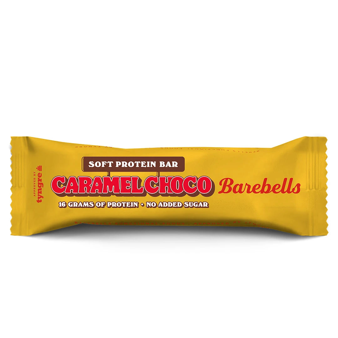 Barebells Soft protein bar 55 g keltaisessa pakkauksessa, jossa on punainen teksti, makuna Caramel Choco., kuva 4/21