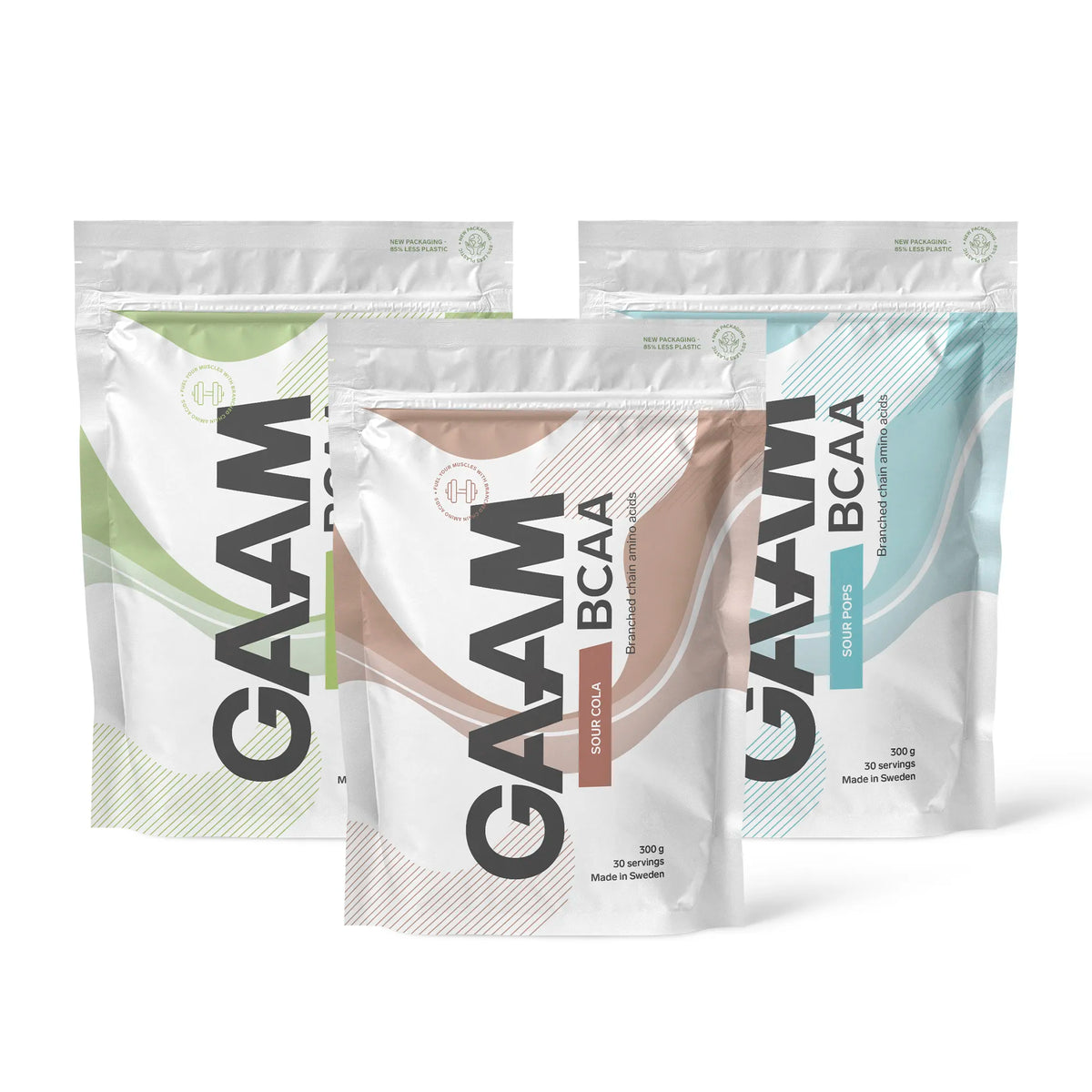 3 x GAAM BCAA 300 g -aminohappoja kolmessa valkoisessa pussissa, joissa on vihreitä, ruskeita ja sinisiä yksityiskohtia eri mauille., kuva 1/1