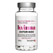 BioSalma Multivitamin Kvinna D3++ 100 tabs läpinäkyvässä purkissa, valkoinen etiketti, pinkit yksityiskohdat ja hopeakansi.