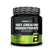 BioTechUSA 100% Creatine Monohydrate 500 g kreatinpulver i en svart burk med gröna detaljer för smaken Naturell.