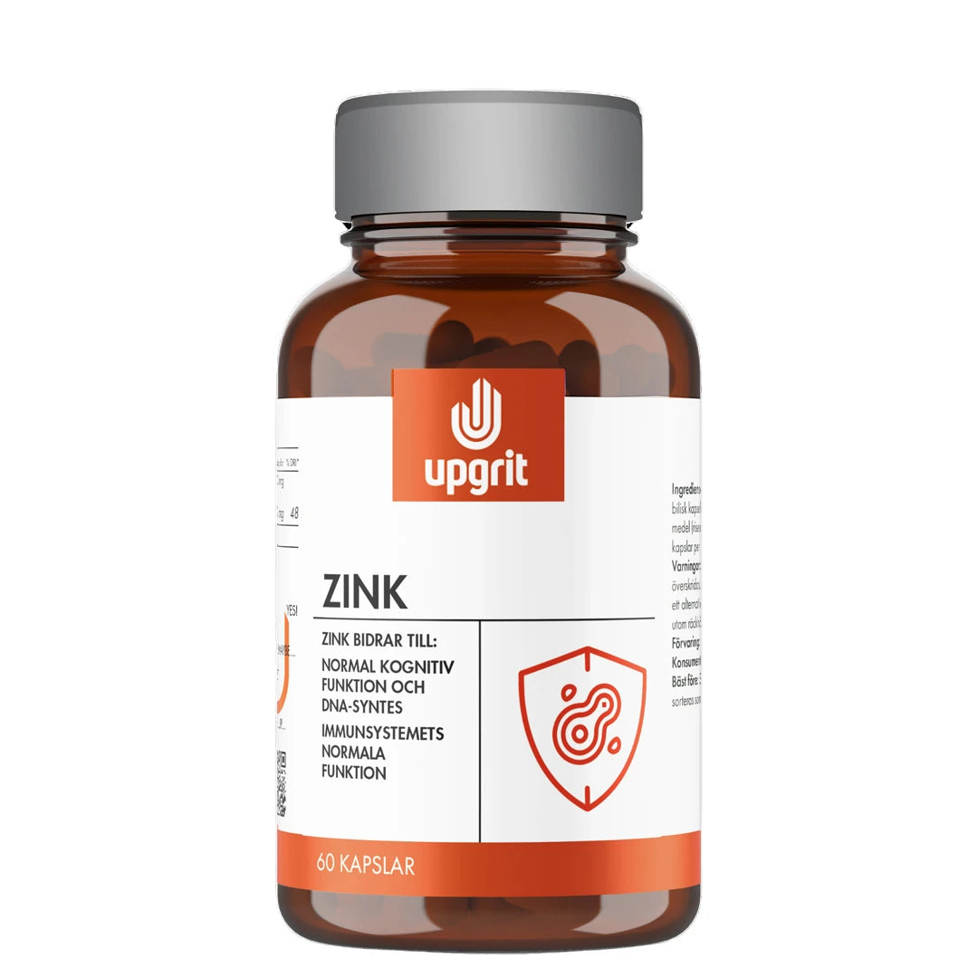 Upgrit Zink 60 caps -ravintolisä tummanruskeassa purkissa, jossa on harmaa kansi, valkoinen etiketti ja oranssi logo., kuva 1/1