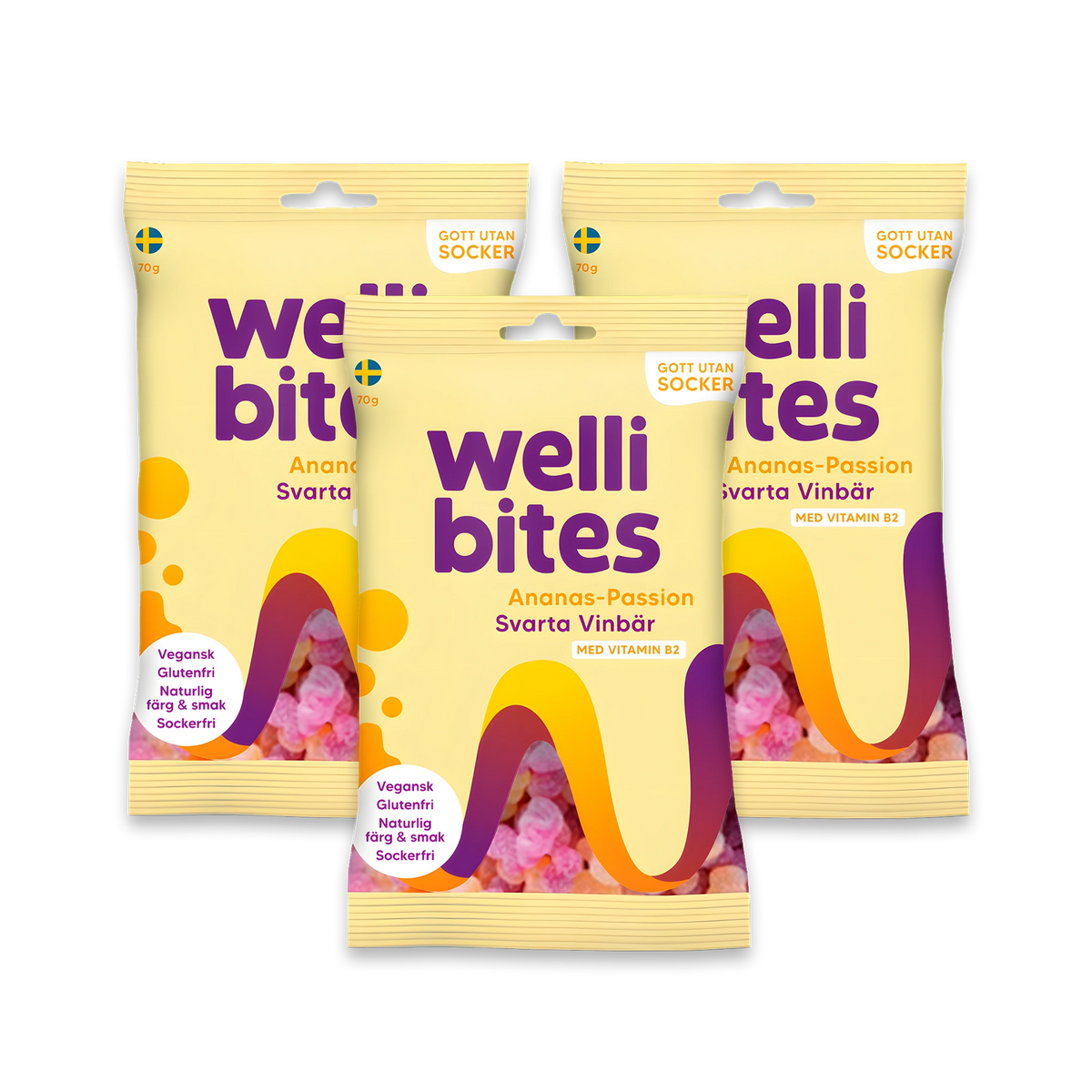 3 x Wellibites Candy 70 g -sokeriton karkki kolmessa keltaisessa pussissa violeteilla ja oransseilla yksityiskohdilla, makuna Ananas-Passion &amp; Mustaherukka., kuva 1/1