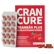 Elexir Pharma Cran Cure 60 tabs, kosttillskott för urinvägarna i en röd ask tillsammans med en blisterkarta med bruna tabletter.