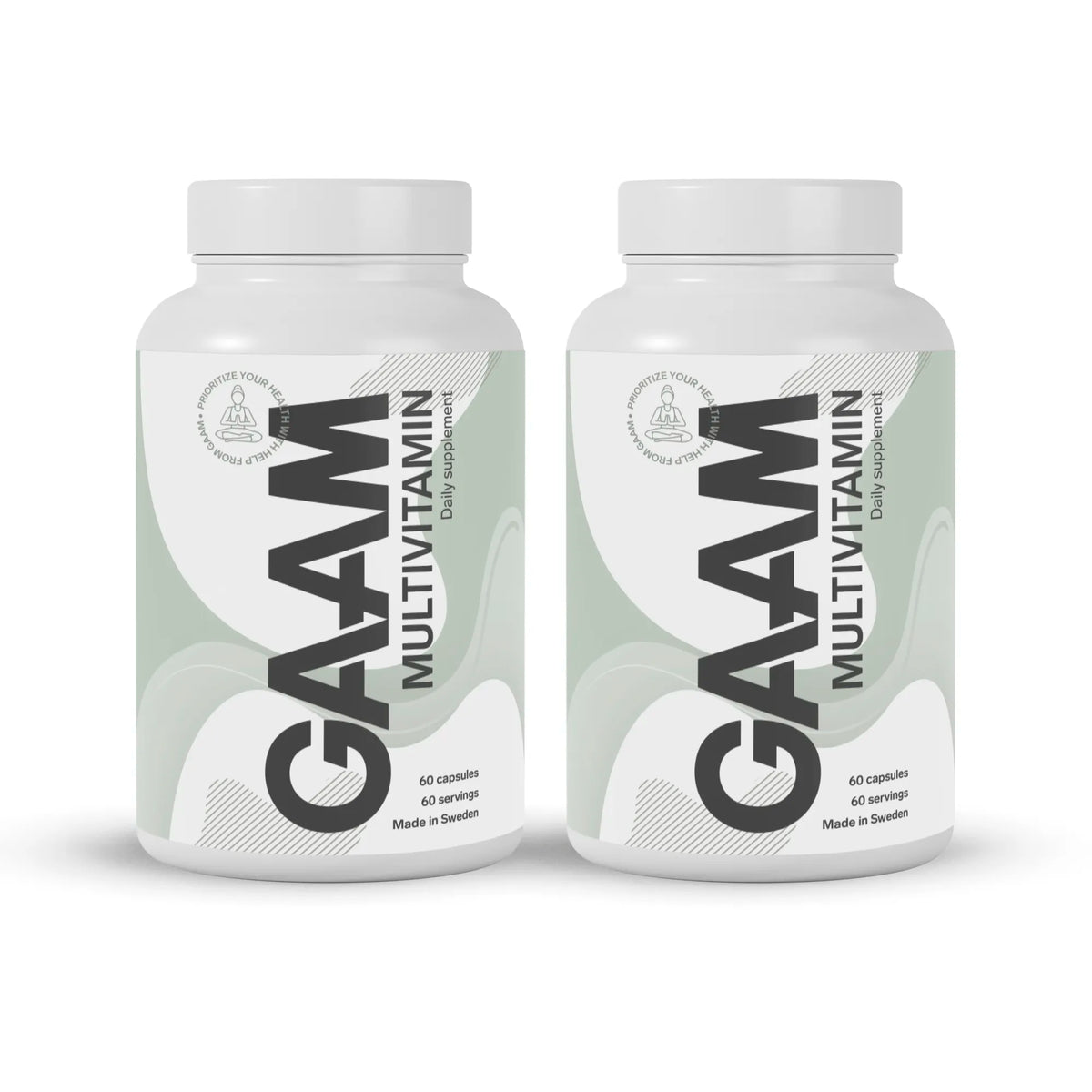 2 x GAAM Multivitamin 60 caps kahdessa valkoisessa purkissa, joissa on vaaleanvihreitä yksityiskohtia ja musta teksti., kuva 1/1