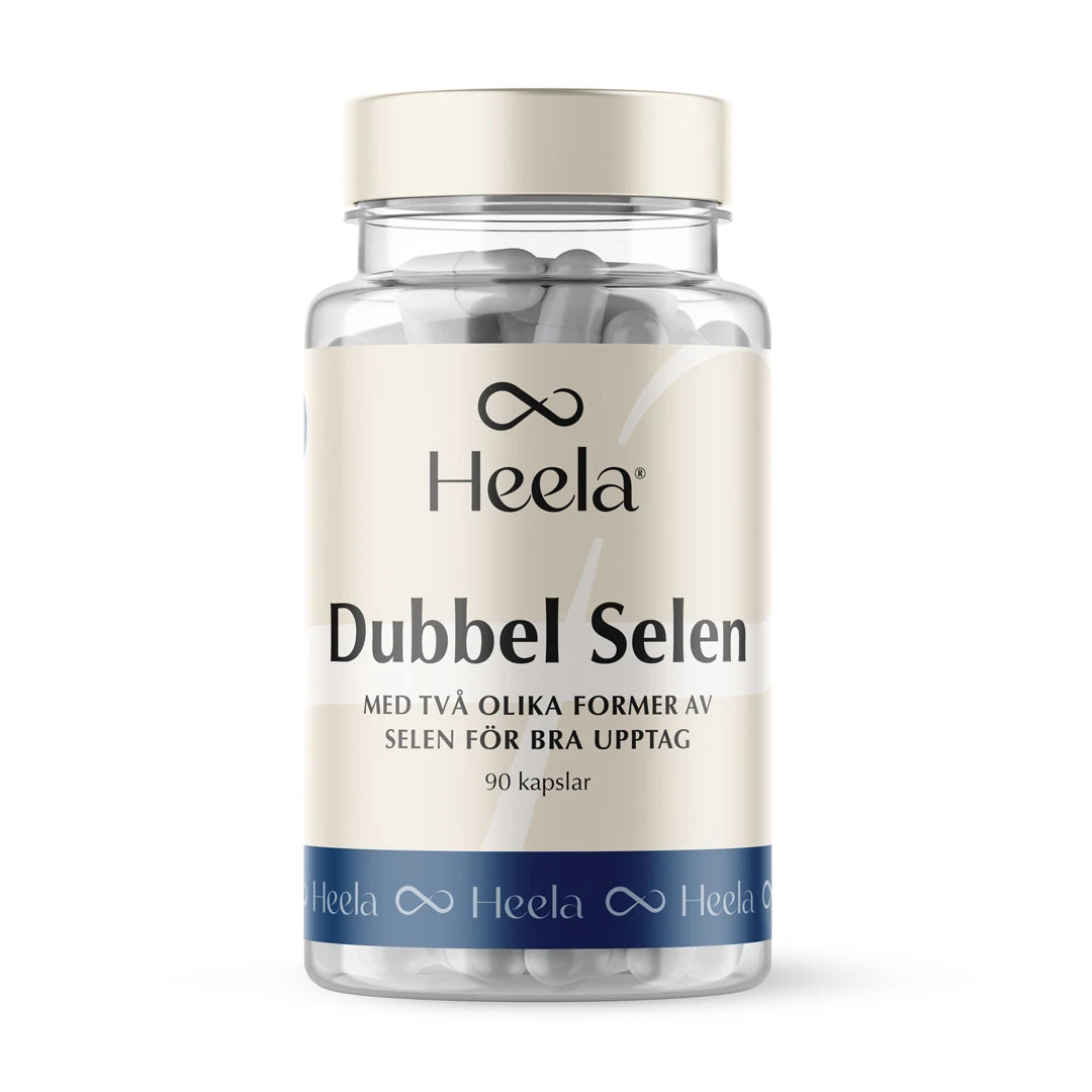 Heela Dubbel Selen 100 µg 90 caps läpinäkyvässä muovipurkissa, jossa on vaaleanbeige etiketti ja valkoisia kapseleita., kuva 1/1
