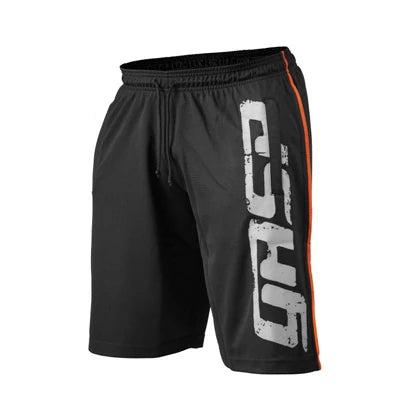 Gasp Pro Mesh Shorts Black -treenishortsit, joissa on suuri valkoinen logo, oranssi sivuraita ja kiristysnauha vyötäröllä.