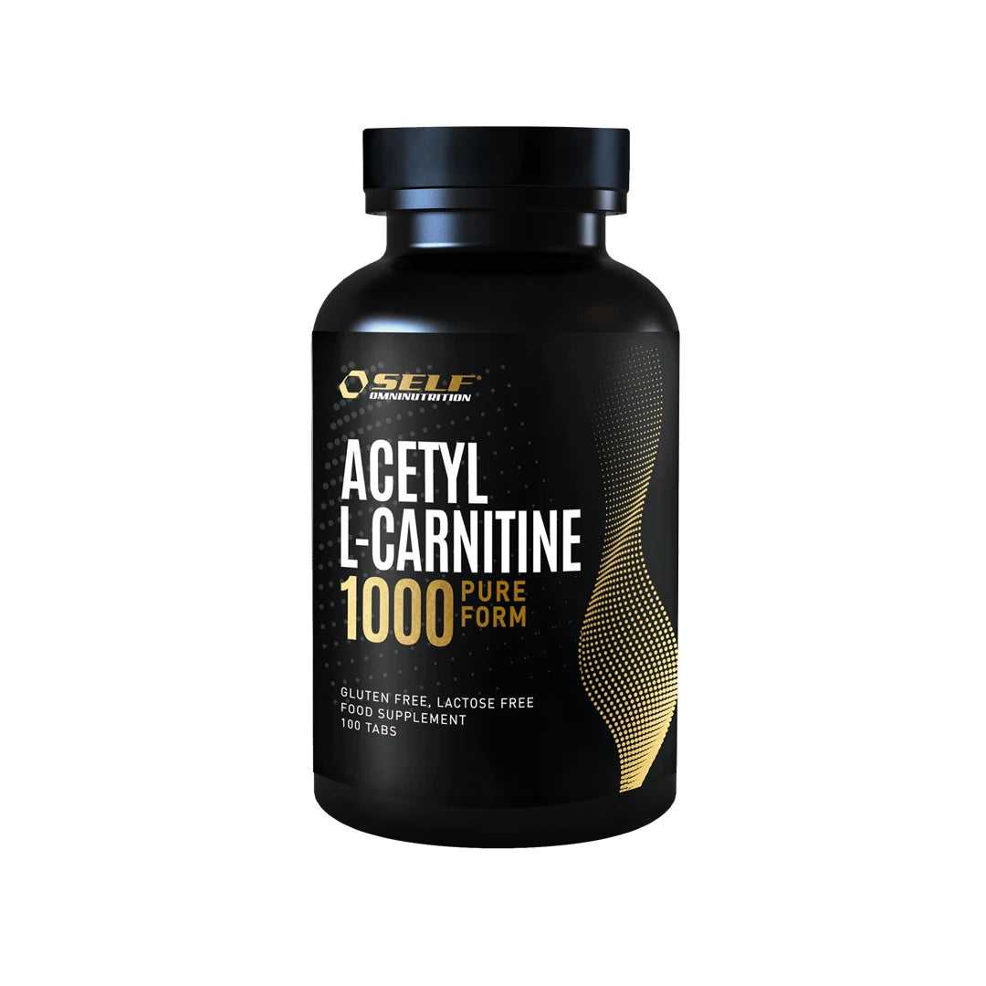 Self Omninutrition Acetyl L-Carnitine 1000 100 tabs -ravintolisä mustassa purkissa, jossa on kultaisia ja valkoisia yksityiskohtia., kuva 1/1