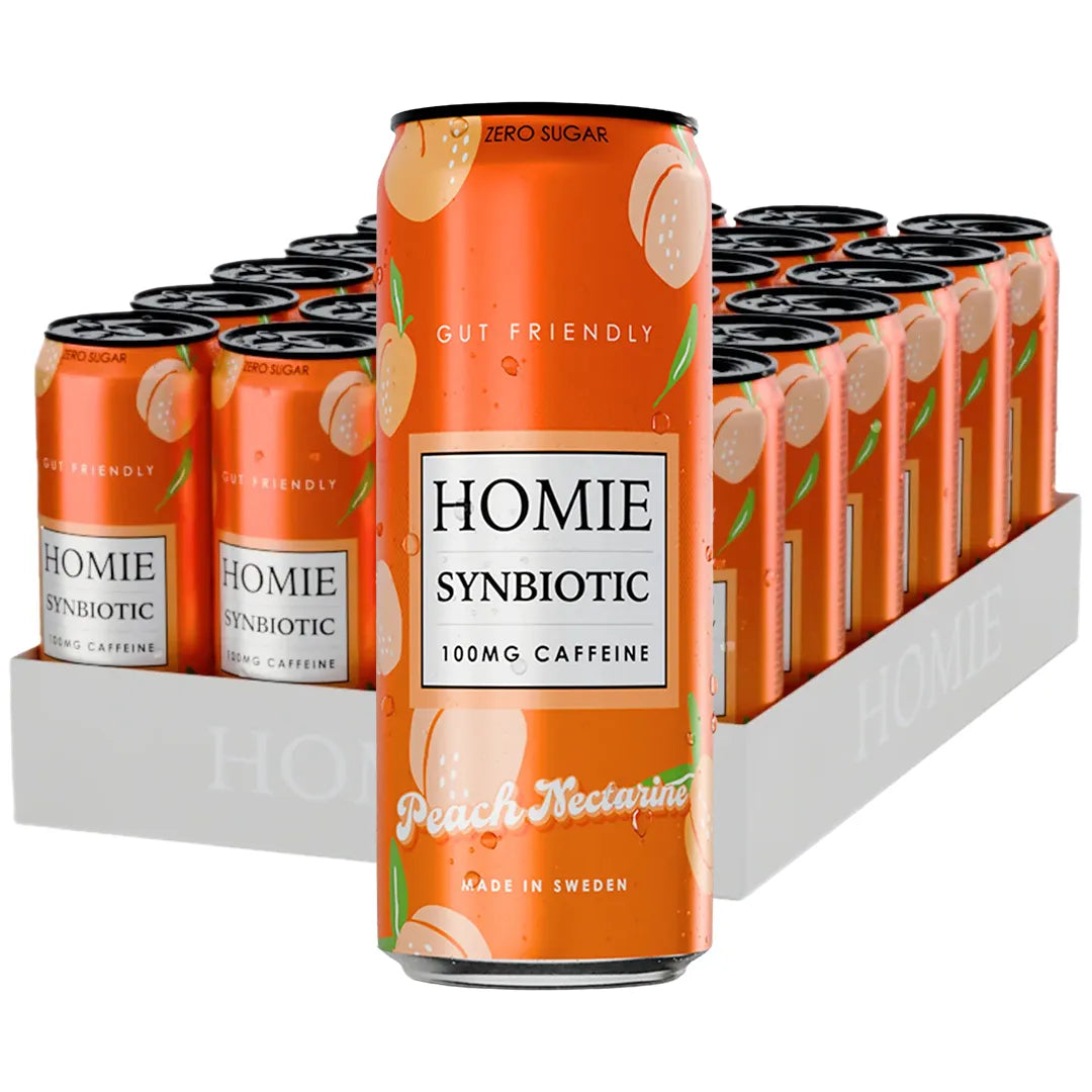 24 x Homie Wake Up Synbiotic 330 ml Peach Nectarine valkoisessa laatikossa oransseja tölkkejä persikkakuvioilla., kuva 1/1