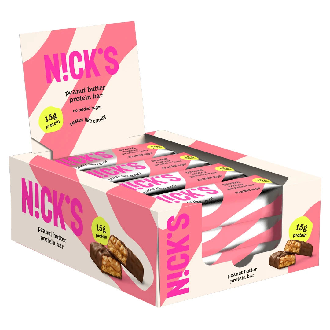 12 x NICKS Soft bar 50 g Peanut Butter vaaleanpunavalkoisessa laatikossa, jonka sisällä on yhteensopivia pakkauksia., kuva 1/1