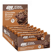 10 x Optimum Nutrition Protein Bar 65 g Chocolate Brownie Crunch ruskeassa laatikossa, jossa on proteiinipatukoita.