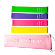 Booty Builder Mini Bands Pink 4-Pack med träningsband i fyra färger och en praktisk rosa förvaringspåse.