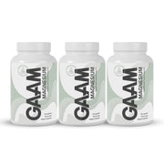 3 x GAAM Magnesium 90 caps kolmessa valkoisessa purkissa, joissa on vaaleanvihreitä yksityiskohtia ja mustaa tekstiä.