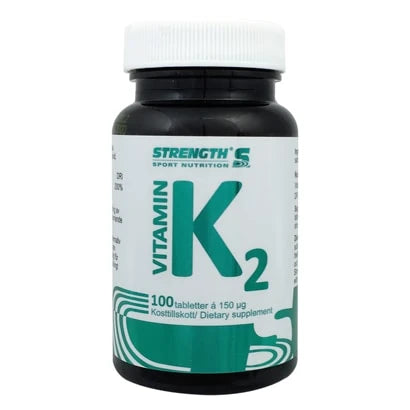 Strength Vitamin K2 100 caps mustassa muovipurkissa, jossa on valkoinen kansi ja vihreää tekstiä etiketissä., kuva 1/1