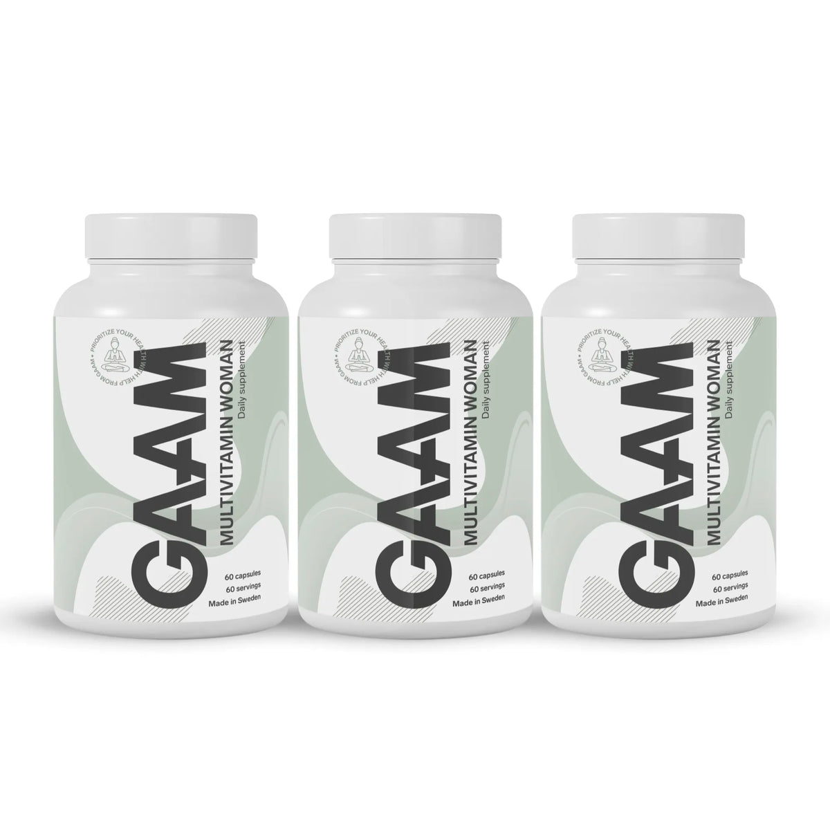3 x GAAM Multivitamin Woman 60 caps -ravintolisä kolmessa valkoisessa purkissa vaaleanvihreillä yksityiskohdilla., kuva 1/1
