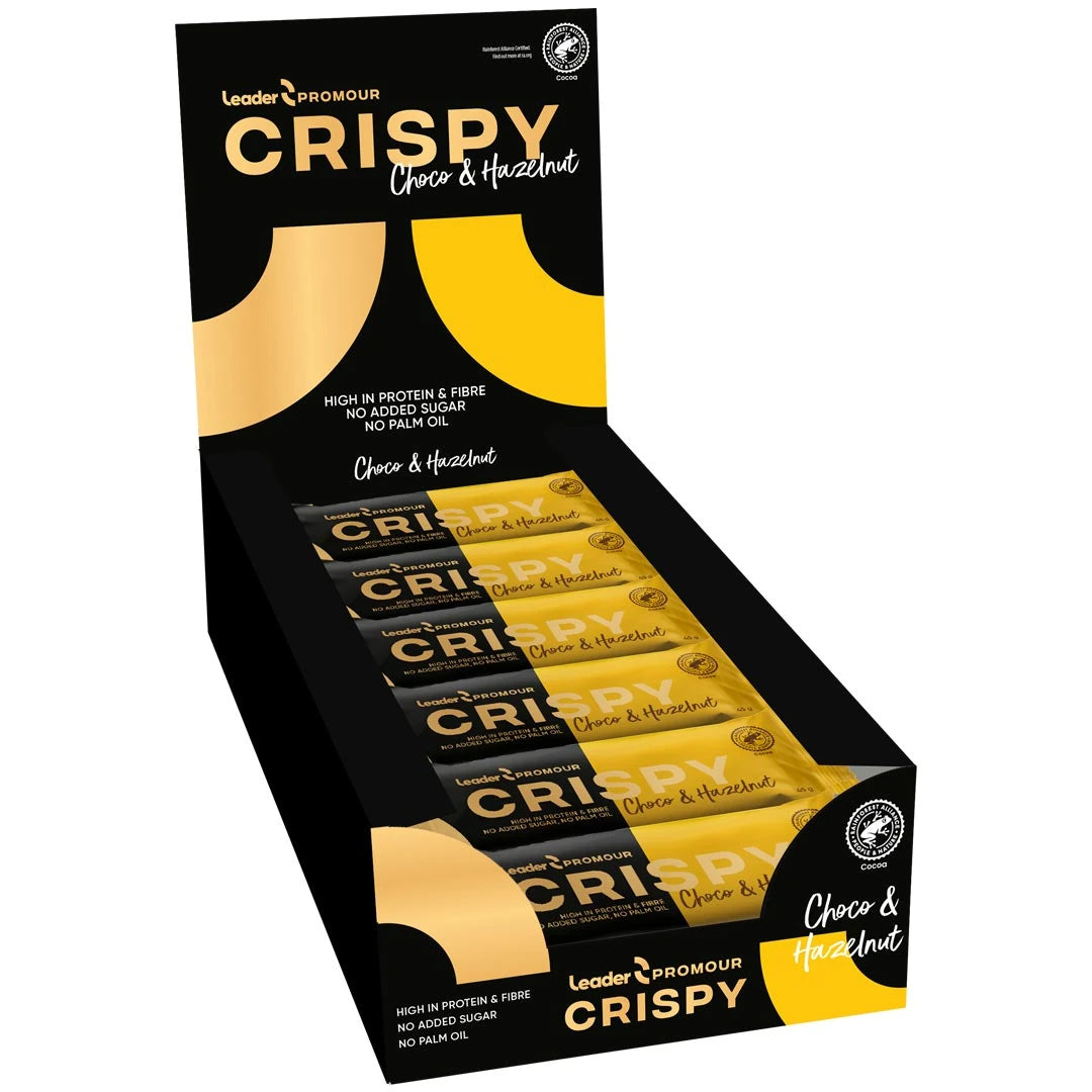 18 x Leader Promour Crispy 45 g Chocolate &amp; Hazelnut musta-keltaisessa laatikossa, joka on täytetty proteiinipatukoilla., kuva 1/1