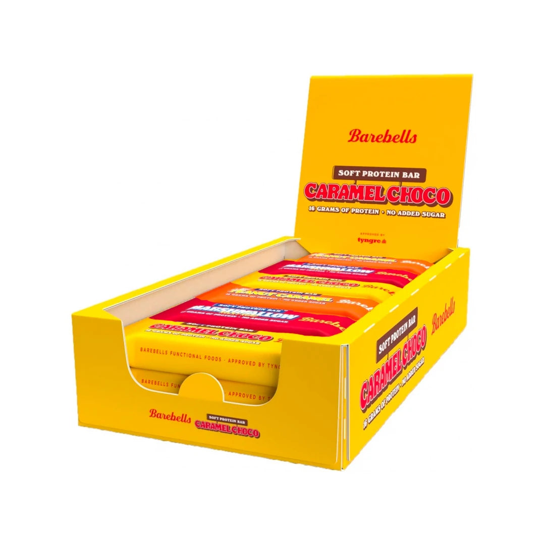 12 x Barebells Soft / Protein Bar Mixlåda 55 g avoimessa keltaisessa esittelylaatikossa, joka on täytetty eri makuisilla proteiinipatukoilla., kuva 1/1